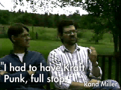 the following are screenshots with subtitles from the making of myst movie. Robyn and Rand Miller sitting on a bench, subtitle I had to have Kraft Punk, full stop