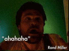 Animated GIF of Rand Miller making a weird face in front of a green screen, quote ahahaha.